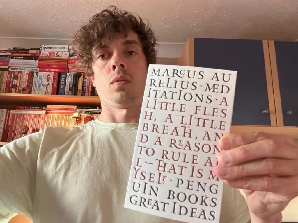 Tom holding his copy of Meditations
